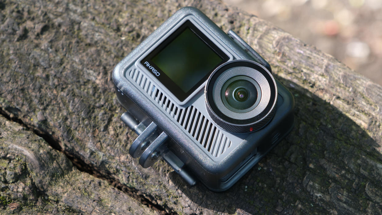  Akaso Brave 8 Lite action camera on a wooden surface outside. 