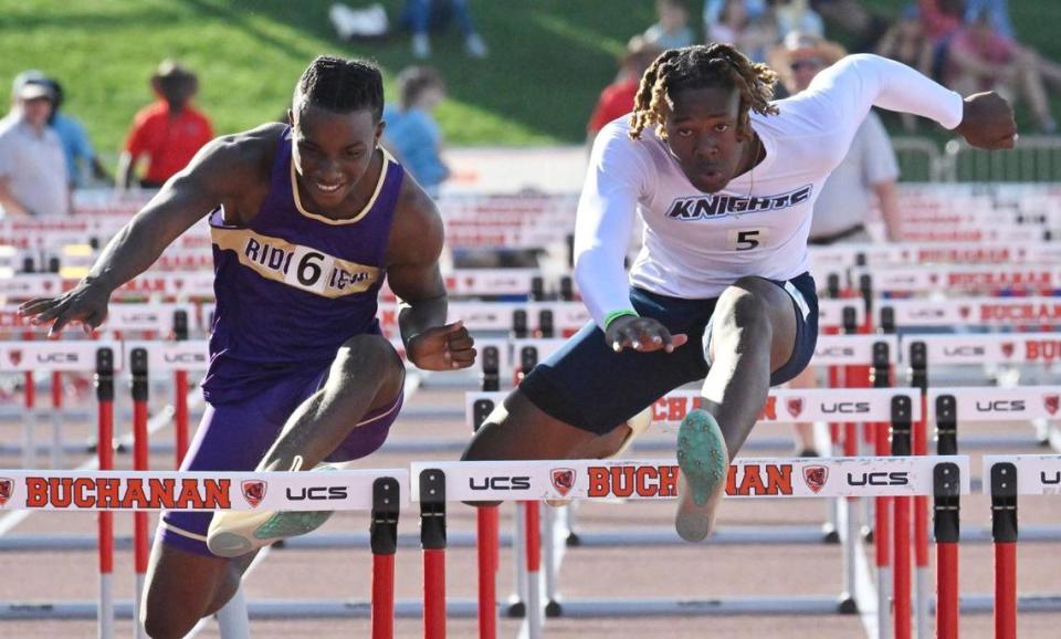 Bullard’s Kyle Hughes, right, on his way to first place edging out second place finisher Ridgeview’s Mekyi Patterson, left, in the 110 hurdles at the CIF Central Section Masters track and field meet, held at Veterans Memorial Stadium on Saturday, May 20, 2023 in Clovis.