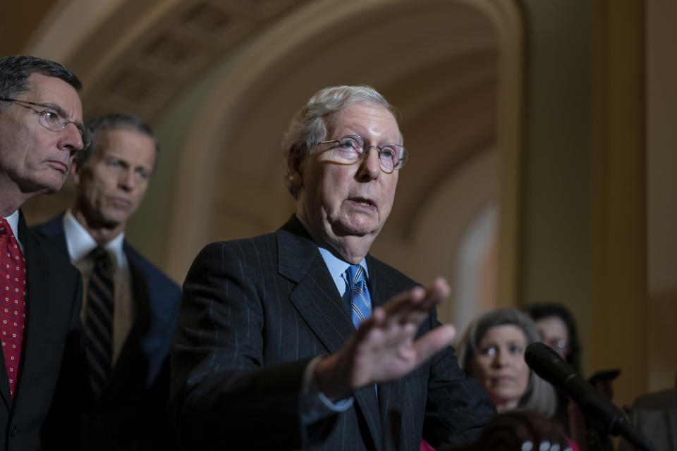 Senate Majority Leader Mitch McConnell, R-Ky., joined at left by Sen. John Barrasso, R-Wyo., and Majority Whip John Thune, R-S.D., speaks to reporters just after they met with Attorney General William Barr to discuss expiring provisions of the Foreign Intelligence Surveillance Act and other government intelligence laws, on Capitol Hill in Washington, Tuesday, Feb. 25, 2020. (AP Photo/J. Scott Applewhite)