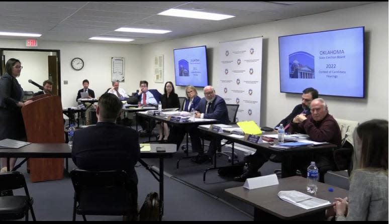 U.S. Senate candidate Madison Horn, bottom right corner, testifies at a special meeting before the Oklahoma State Election Board.