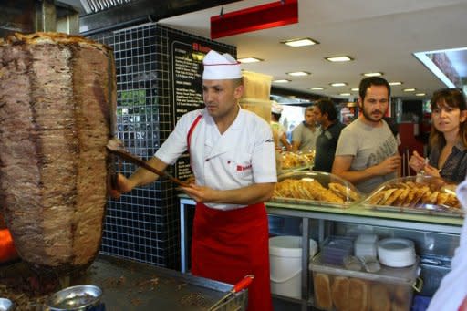 People are seen here at a traditional 'doner' fast food restaurant in Ankara. In Turkey, 35% of the population has accumulated excess body fat to the extent that it may have an adverse effect on health, leading to reduced life expectancy and/or increased health problems