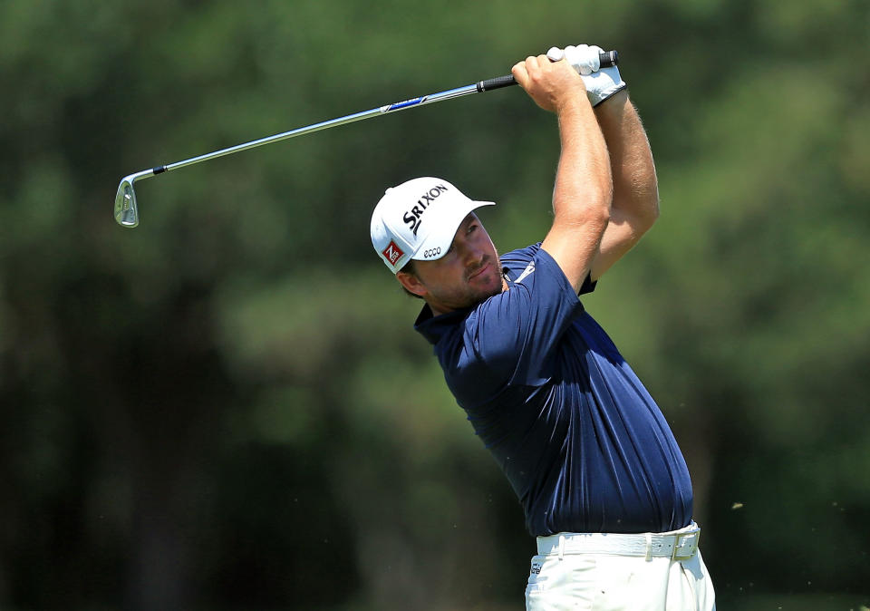 PONTE VEDRA BEACH, FL - MAY 10: Graeme McDowell of Northern Ireland plays his second shot at the par 4, 14th hole during the first round of THE PLAYERS Championship held at THE PLAYERS Stadium course at TPC Sawgrass on May 10, 2012 in Ponte Vedra Beach, Florida. (Photo by David Cannon/Getty Images)