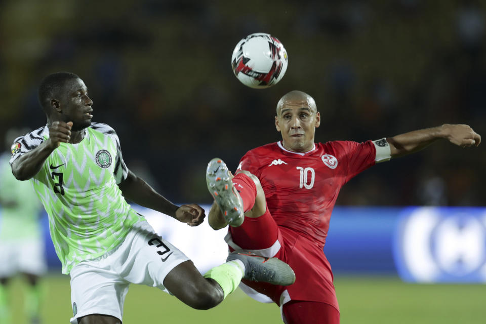 Tunisia's Wahbi Khazri and Nigeria's Jamilu Collins fight for the ball during the African Cup of Nations third place soccer match between Nigeria and Tunisia in Al Salam stadium in Cairo, Egypt, Wednesday, July 17, 2019. (AP Photo/Hassan Ammar)