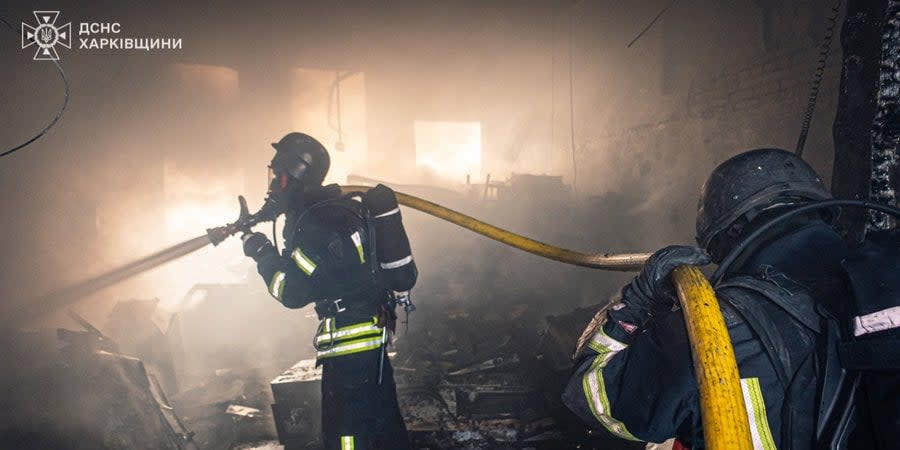 Firefighters combating a blaze after a Russian attack in Kharkiv