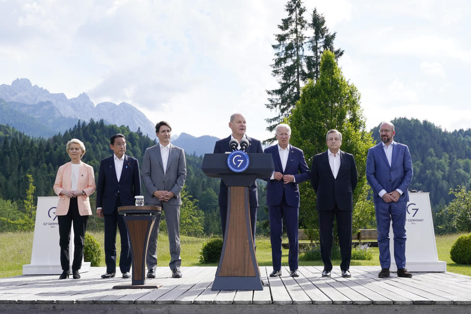 German Chancellor Olaf Scholz with from left, Ursula von der Leyen, President of the European Commission, Fumio Kishida, Prime Minister of Japan, Justin Trudeau, Prime Minister of Canada, U.S. President Joe Biden, Mario Draghi, Prime Minister of Italy and Charles Michel, President of the European Council, speaks and formally launches the global infrastructure partnership on the margins of the G7 Summit in Elmau, Germany, Sunday, June 26, 2022. (AP Photo/Susan Walsh)