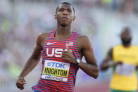 FILE - Erriyon Knighton, of the United States, wins a heat during the men's 200-meter semifinal run at the World Athletics Championships on Tuesday, July 19, 2022, in Eugene, Ore. Teenage sprinter Erriyon Knighton has often drawn comparisons to Jamaican great Usain Bolt. They're comparisons the American doesn't run away from. He embraces the idea of following in Bolt's footsteps and already is breaking Bolt's under-20 records. (AP Photo/Ashley Landis, File)