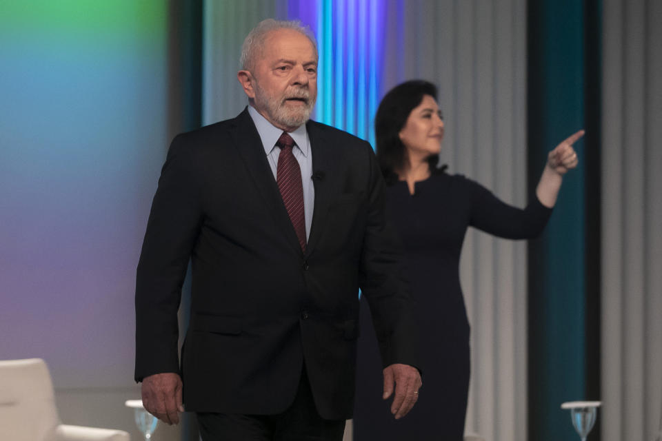 Brazil's former president and now presidential candidate Luiz Inacio "Lula" da Silva of the Workers' Party, and Presidential candidate Simone Tebet of the Brazilian Democratic Movement Party, arrive to attend a presidential debate in Rio de Janeiro, Brazil, Thursday, Sept. 29, 2022. Brazil will hold general elections on Oct. 2. (AP Photo/Bruna Prado)