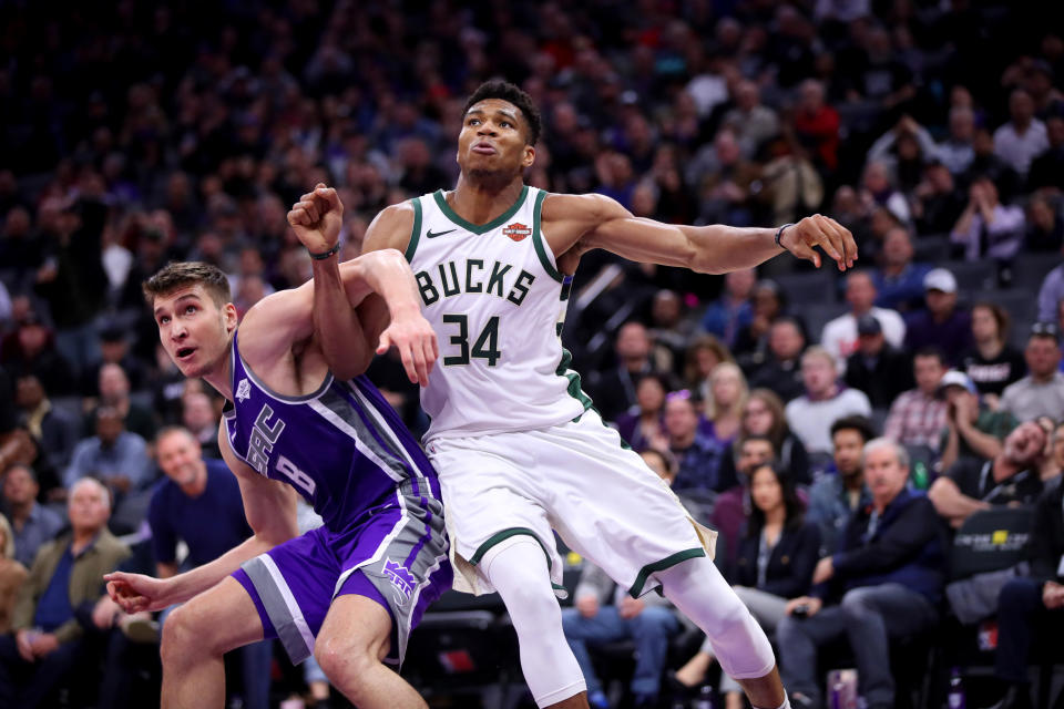 Feb 27, 2019; Sacramento, CA, USA; Milwaukee Bucks forward Giannis Antetokounmpo (34) battles for position with Sacramento Kings guard Bogdan Bogdanovic (8) in the fourth quarter at the Golden 1 Center. Mandatory Credit: Cary Edmondson-USA TODAY Sports