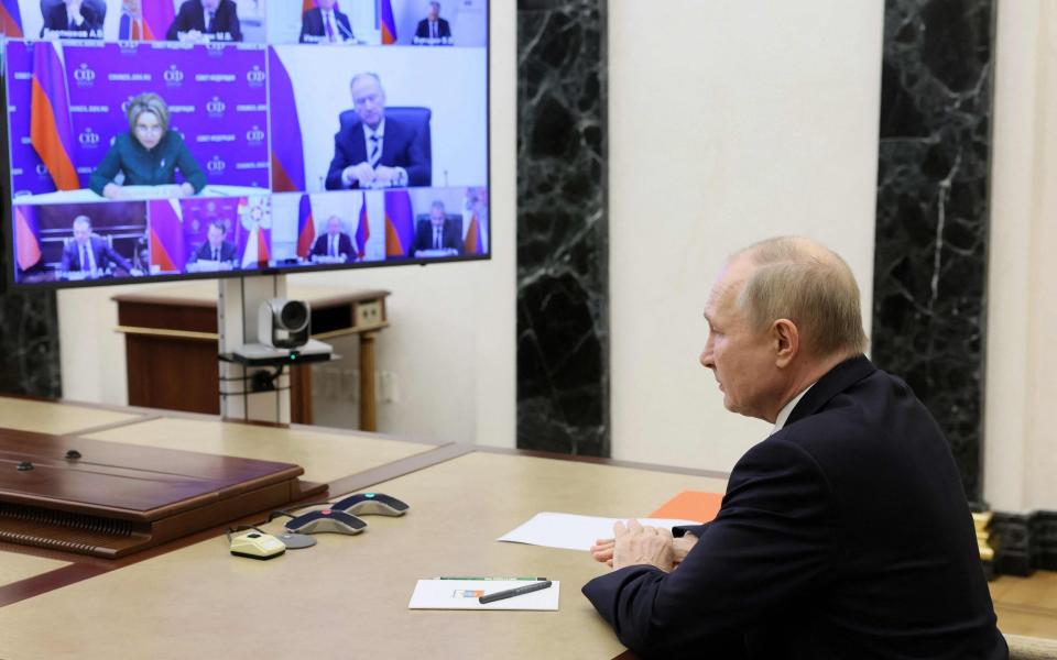 Russia's President Vladimir Putin chairs a meeting with members of the Security Council via a video conference call at the Novo-Ogaryovo state residence, outside Moscow, on December 6, 2022. (Photo by Mikhail Metzel / SPUTNIK / AFP) (Photo by MIKHAIL METZEL/SPUTNIK/AFP via Getty Images) - MIKHAIL METZEL/SPUTNIK/AFP via Getty Images