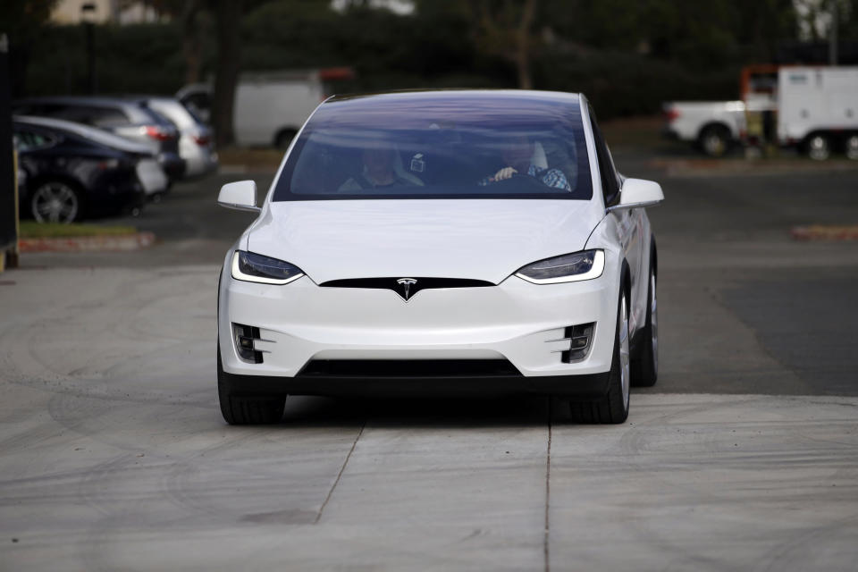 The Tesla Model X car is test driven at the company's headquarters Tuesday, Sept. 29, 2015, in Fremont, Calif. Tesla's Model X — one of the only all-electric SUVs on the market — was officially unveiled Tuesday night near the company's California factory. (AP Photo/Marcio Jose Sanchez)