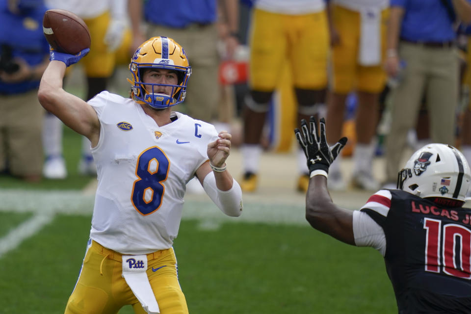 Pittsburgh quarterback Kenny Pickett (8) passes as he is pressured by Austin Peay defensive end Terrell Lucas (10) during the first half of an NCAA college football game, Saturday, Sept. 12, 2020, in Pittsburgh. (AP Photo/Keith Srakocic)