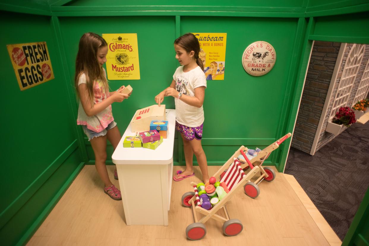 Kids can explore miniature versions of a camper, service station, market, library, firehouse, and school at Penn's Little Village at the Bucks County Free Library's Lanhorne branch.