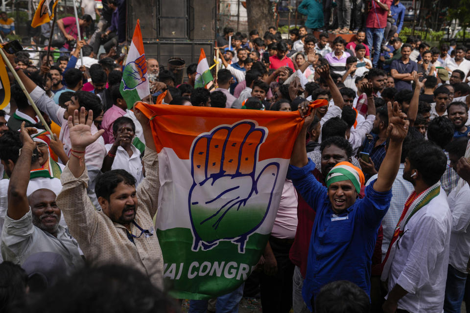 Supporters of India's main opposition party, Indian National Congress, celebrate early leads for their party in Telangana state elections in Hyderabad, India, Sunday, Dec.3, 2023. India’s Hindu nationalist party was headed for a clear win in three out of four states Sunday, according to the election commission’s website. (AP Photo/Mahesh Kumar A)