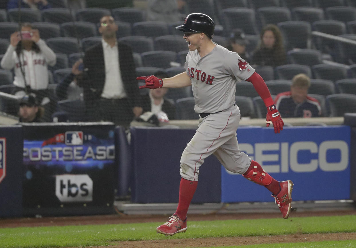 The Red Sox’s Brock Holt rounds the bases after hitting a two-run home run against the Yankees during the ninth inning Monday night. (AP)