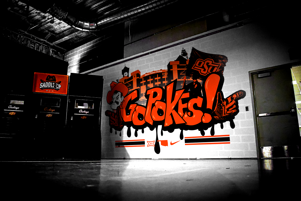 A street graffiti art mural is pictured inside Boone Pickens Stadium. The mural, painted in May by Logan Rogers and Becs Burroughs, is used for photos during unofficial recruiting visits by all athletic teams and is believed to be the only one of its kind among college programs.