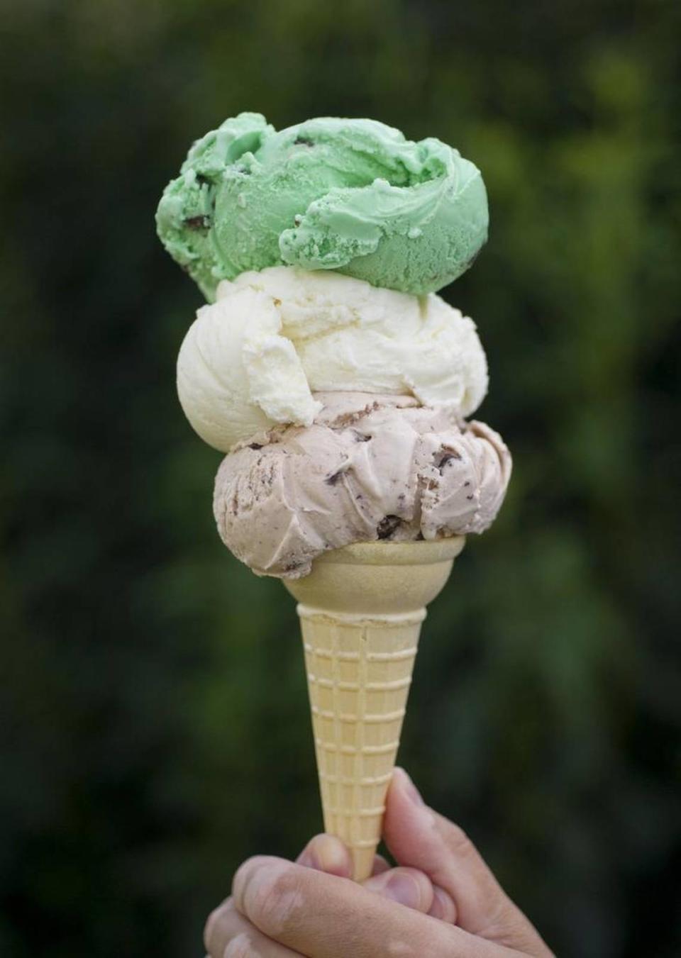 A three scoop ice cream cone from Meyer Dairy with chocolate brownie, vanilla and mint chocolate chip.