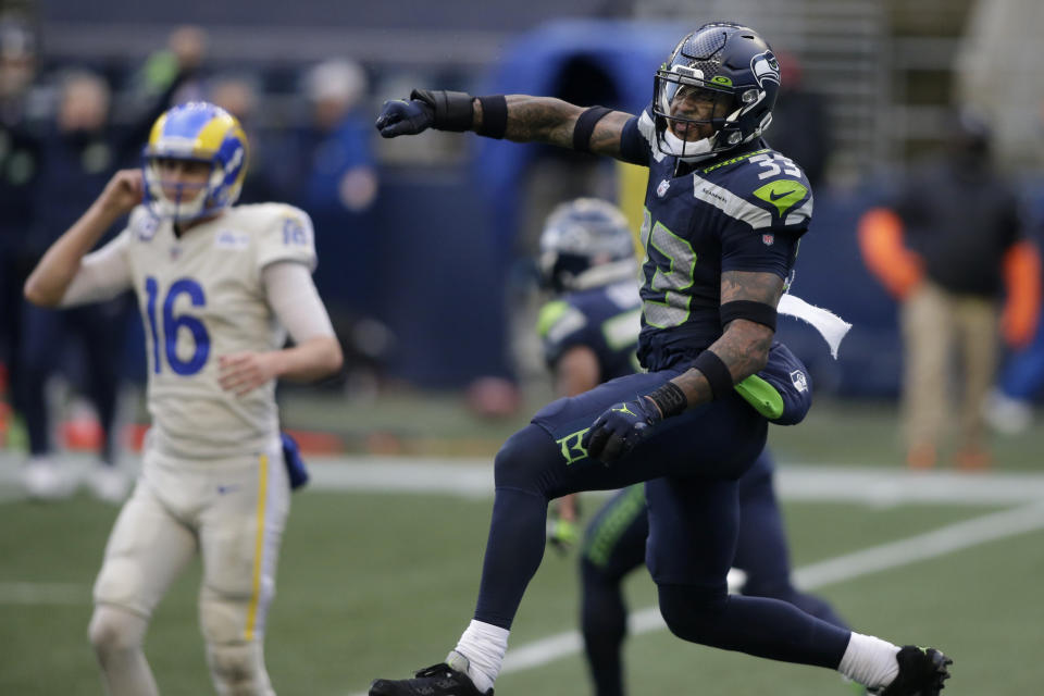 Seattle Seahawks strong safety Jamal Adams (33) reacts to a play with Los Angeles Rams quarterback Jared Goff (16) in the background, during the second half of an NFL football game, Sunday, Dec. 27, 2020, in Seattle. (AP Photo/Scott Eklund)