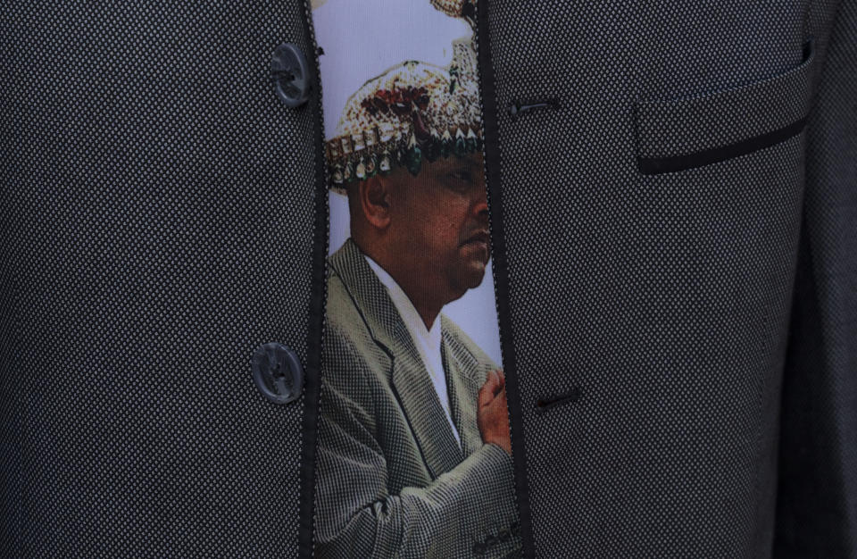 A portrait of Nepal's former king Gyanendra is seen on a t-shirt of a protester during a rally demanding a restoration of Nepal's monarchy in Kathmandu, Nepal, Thursday, Nov. 23, 2023. Riot police used batons and tear gas to halt tens of thousands of supporters of Nepal's former king demanding the restoration of the monarchy and the nation's former status as a Hindu state. Weeks of street protests in 2006 forced then King Gyanendra to abandon his authoritarian rule and introduce democracy. (AP Photo/Niranjan Shrestha)