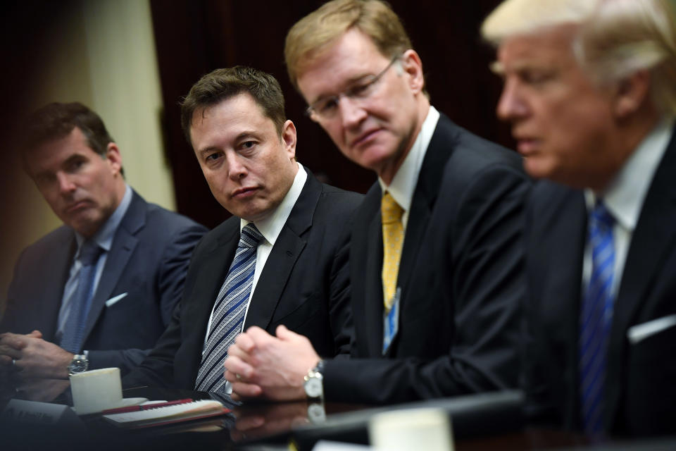 WASHINGTON, DC - JANUARY 23: Elon Musk, left center, and Wendell P. Weeks, right center, listen to President Donald Trump, right, as he meets with business leaders at the White House on Monday January 23, 2017 in Washington, DC. (Photo by Matt McClain/The Washington Post via Getty Images)