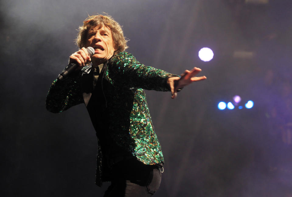 FILE - Mick Jagger of The Rolling Stones performs in Glastonbury, England on June 29, 2013. Jagger's jacket is among 55 L'Wren Scott creations going on sale this week at Christie’s in London. (Photo by Jim Ross/Invision/AP, File)