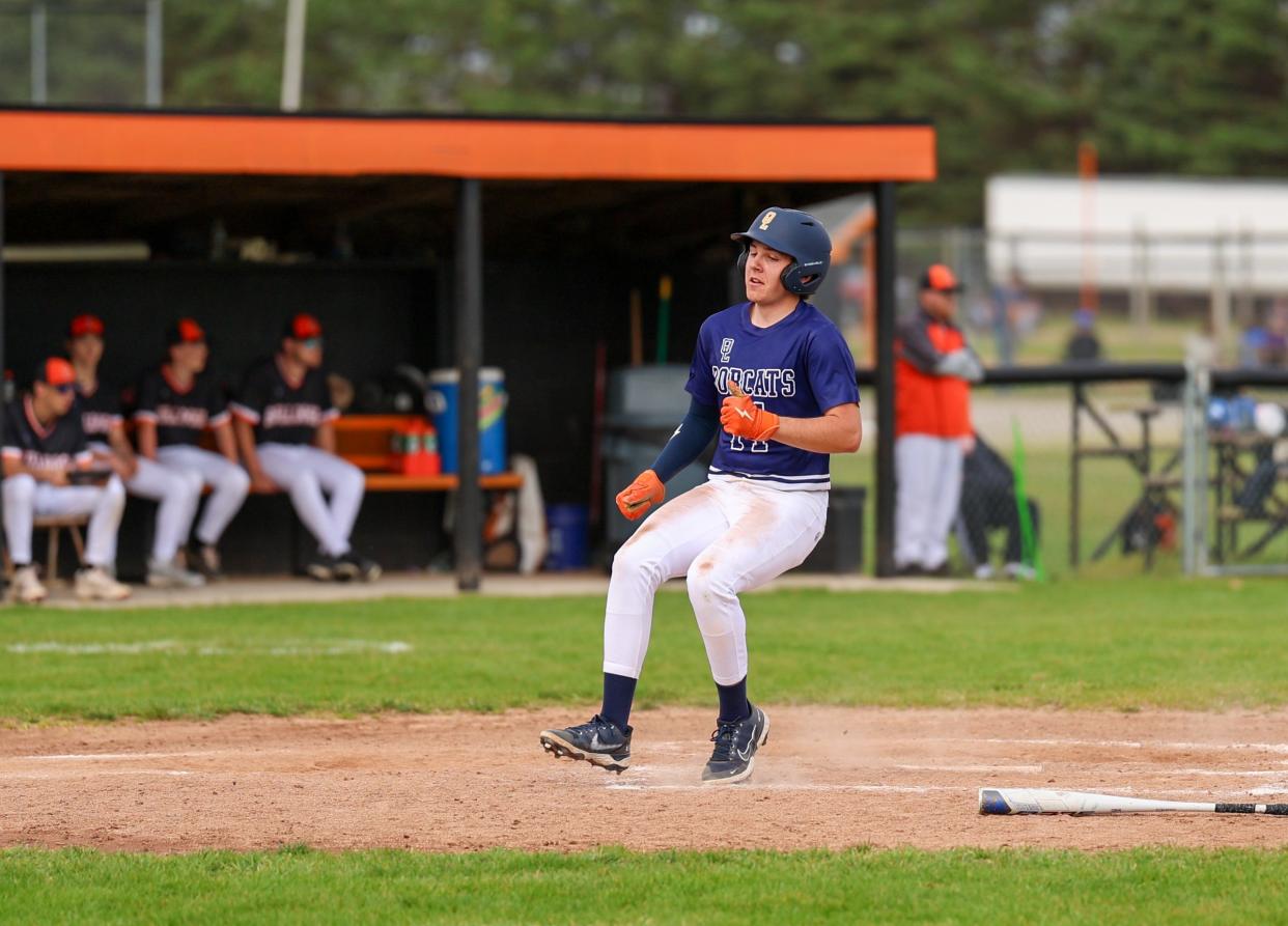 Logan Keane scores a run for Whiteford against Summerfield on Thursday, April 18, 2024.