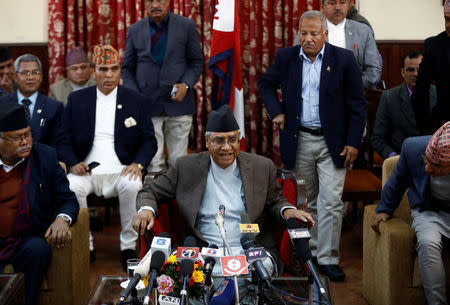 Nepalese Prime Minister Sher Bahadur Deuba smiles as he leaves after announcing his resignation in Kathmandu, Nepal February 15, 2018. REUTERS/Navesh Chitrakar