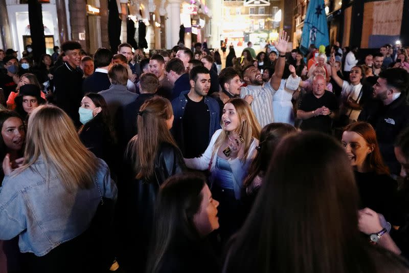 People sing and dance in Leicester Square, amid the coronavirus disease (COVID-19) outbreak, in London