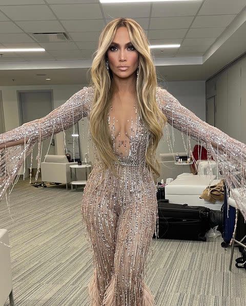 <p>Chris Appleton then went on to share another behind-the-scenes snap of J.Lo rocking this semi-sheer catsuit with a plunging V neckline.</p><p><a href="https://www.instagram.com/p/COa9GPchD_J/" rel="nofollow noopener" target="_blank" data-ylk="slk:See the original post on Instagram;elm:context_link;itc:0;sec:content-canvas" class="link ">See the original post on Instagram</a></p>