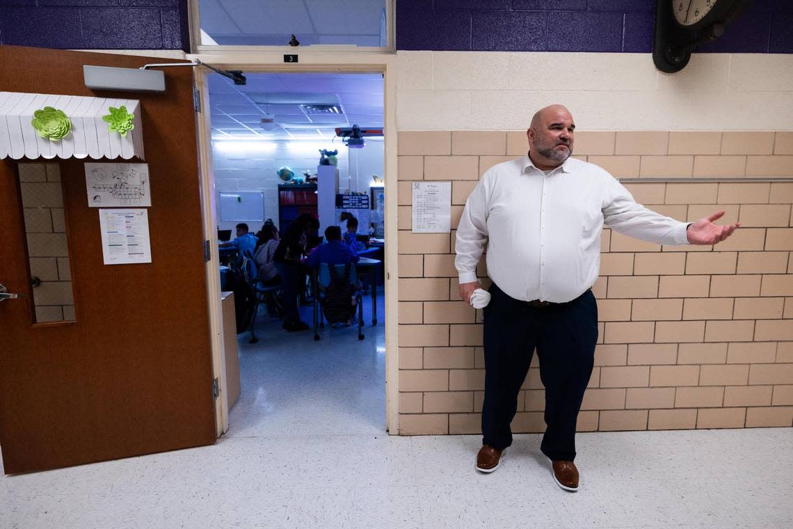Principal Danny Fracassi stands in the hallway of the Leadership Academy at Mitchell Boulevard Elementary on Oct. 6, 2022, in Fort Worth. FWISD partnered with Texas Wesleyan University to operate six struggling schools.
