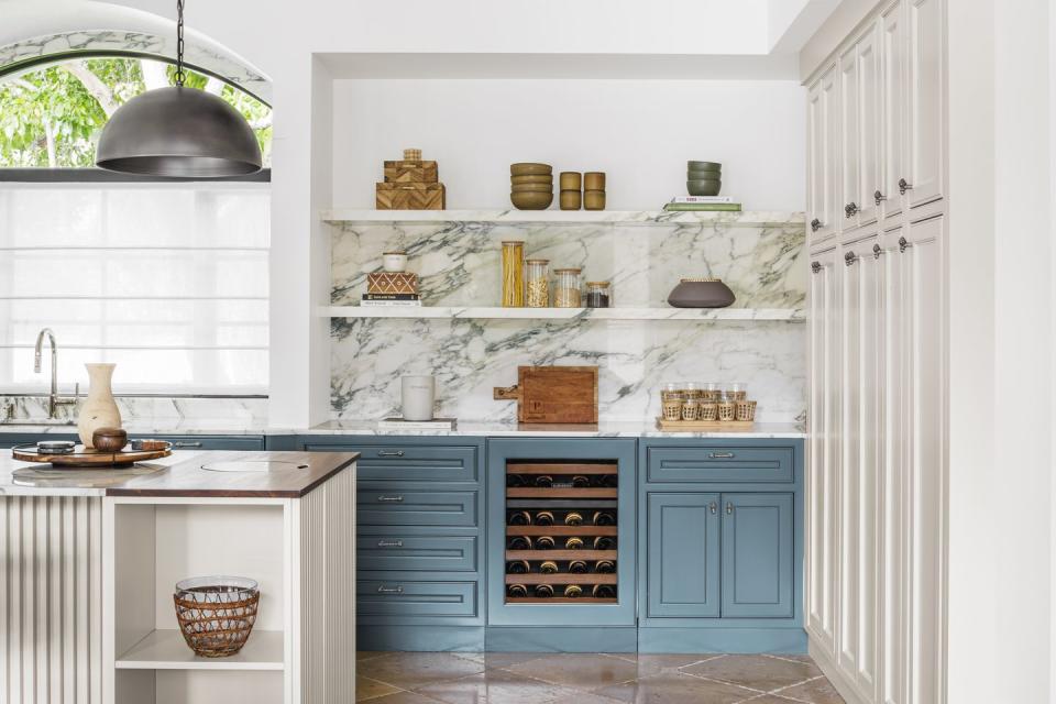 light blue lower cabinets with marble backsplash