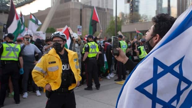 Toronto police separated pro-Palestinian and pro-Israeli demonstrators at Nathan Phillips Square on Saturday.