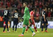 Manchester United's goalkeeper David de Gea reacts at the end of the Champions League quarterfinal second leg soccer match between Bayern Munich and Manchester United in the Allianz Arena in Munich, Germany, Wednesday, April 9, 2014. Bayern won 3-1 to win the tie 4-2 on aggregate. (AP Photo/Matthias Schrader)