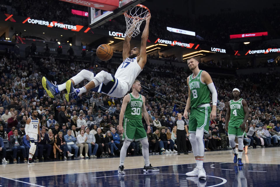 Minnesota Timberwolves center Rudy Gobert (27) dunks during the first half of an NBA basketball game against the Boston Celtics, Monday, Nov. 6, 2023, in Minneapolis. (AP Photo/Abbie Parr)