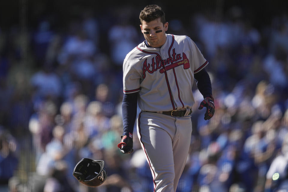 Atlanta Braves' Austin Riley tosses his helmet after striking out in the first inning against the Los Angeles Dodgers in Game 3 of baseball's National League Championship Series Tuesday, Oct. 19, 2021, in Los Angeles. (AP Photo/Ashley Landis)