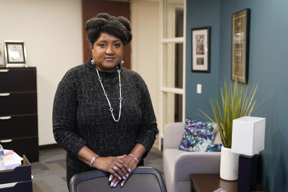 Lisa Rice, President and CEO of the National Fair Housing Alliance, poses for a photo in her office, Wednesday, Oct. 28, 2020, in Washington. Several fair housing organizations accused Redfin of systematic racial discrimination in a lawsuit filed Oct. 29, saying the online real estate broker offers fewer services to homebuyers and sellers in minority communities _ a type of “digital redlining” that has depressed home values and exacerbated historic injustice in the housing market. (AP Photo/Patrick Semansky)