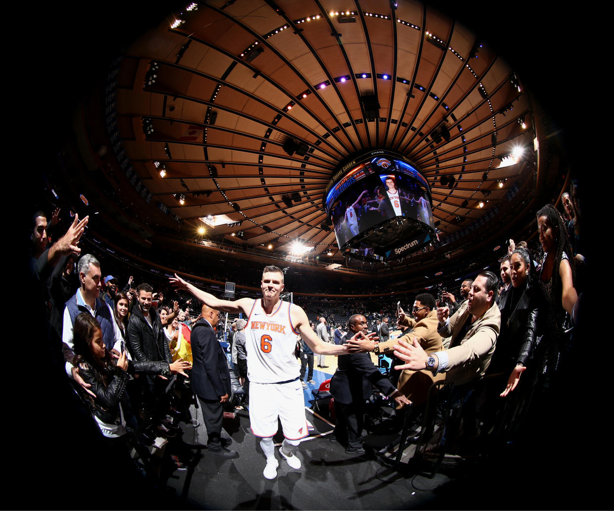 Kristaps Porzingis high-fives fans after the Knicks’ win over the Denver Nuggets on Oct. 30, 2017. (Nathaniel S. Butler/NBAE/Getty Images)