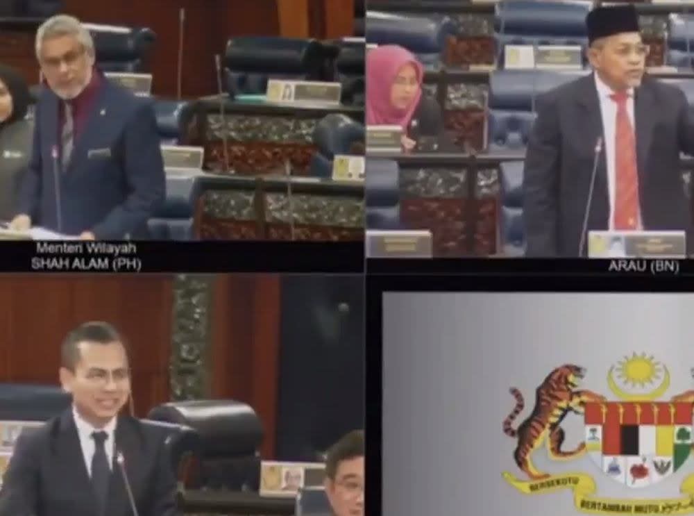 Members of Parliament smile when Arau MP Datuk Seri Shahidan Kassim informs that Malaysia has taken the lead against Indonesia. — Screengrab via Twitter/@HafizRayyan