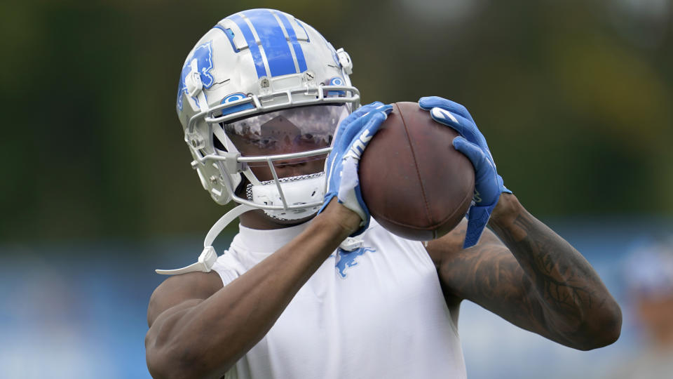 Detroit Lions wide receiver DJ Chark catches a ball after an NFL football practice in Allen Park, Mich., Monday, Aug. 1, 2022. (AP Photo/Paul Sancya)