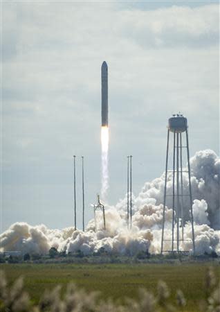 The Orbital Sciences Corporation Antares rocket, with the Cygnus cargo spacecraft aboard, is seen as it launches from NASA Wallops Flight Facility, Virginia in this September 18, 2013 handout photo. Cygnus is on its way to rendezvous with the space station. The spacecraft will deliver about 1,300 pounds (589 kilograms) of cargo, including food and clothing, to the Expedition 37 crew. REUTERS/NASA/Bill Ingalls/Handout (UNITED STATES - Tags: SCIENCE TECHNOLOGY TRANSPORT) THIS IMAGE HAS BEEN SUPPLIED BY A THIRD PARTY. IT IS DISTRIBUTED, EXACTLY AS RECEIVED BY REUTERS, AS A SERVICE TO CLIENTS. FOR EDITORIAL USE ONLY. NOT FOR SALE FOR MARKETING OR ADVERTISING CAMPAIGNS. MANDATORY CREDIT