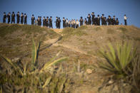 <p>Ultra-Orthodox Jewish men of the Vizhnitz Hassidic sect pray on a hill overlooking the Mediterranean Sea as they participate in a Tashlich ceremony in Herzeliya, Israel, Thursday, Sept. 28, 2017. Tashlich, which means “to cast away” in Hebrew, is the practice in which Jews go to a large flowing body of water and symbolically “throw away” their sins by throwing a piece of bread, or similar food, into the water before the Jewish holiday of Yom Kippur, which starts at sundown Friday. (Photo: Ariel Schalit/AP) </p>