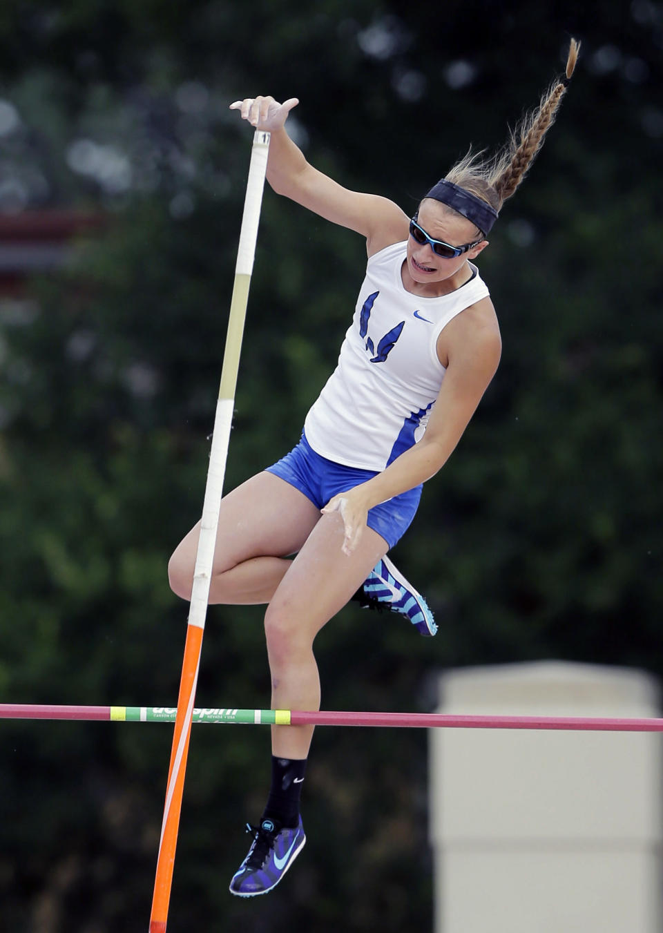 Emory Rains High School's Charlotte Brown competes in the Girls 3A pole vault at the UIL State Track & Field meet, Friday, May 9, 2014, in Austin, Texas. Brown, a pole vaulter who happens to be legally blind, starts on the clap from her coach and counts her steps on her approach. (AP Photo/Eric Gay)