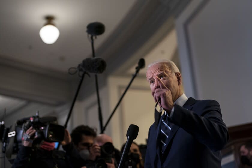 WASHINGTON, DC - JANUARY 13: President Joe Biden speaks to the press after attending a meeting with the Senate Democratic Caucus on Capitol Hill, on Thursday, Jan. 13, 2022 in Washington, DC. Biden has called on his fellow Democrats to do away with the 60-vote threshold for advancing legislation in the Senate and pass the John Lewis Voting Rights Advancement Act and the Freedom To Vote Act (Kent Nishimura / Los Angeles Times)