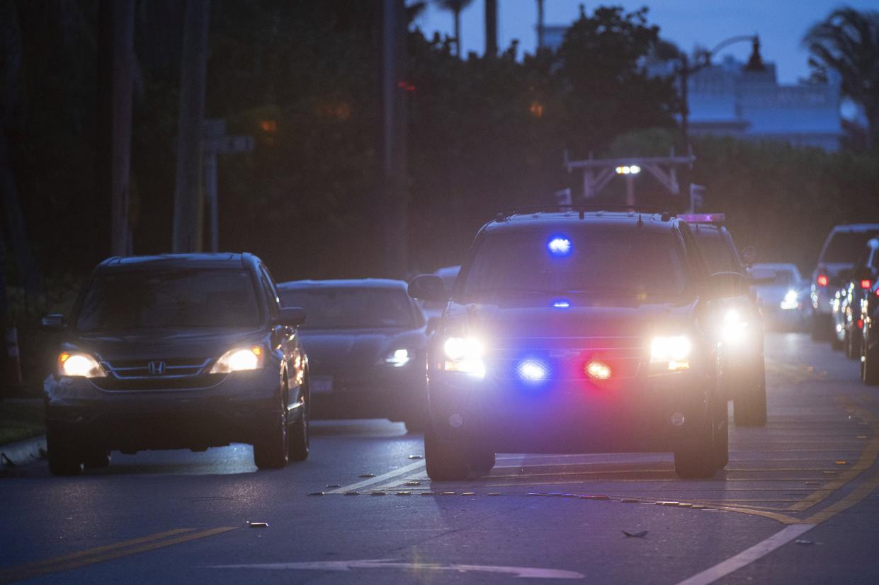 Palm Beach Police officers are seen parked near Mar-A-Lago in Palm Beach, Fla., on Monday, August 8, 2022. 