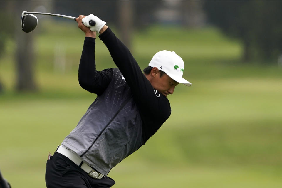 Li Haotong of China, hits his tee shot on the second hole during the third round of the PGA Championship golf tournament at TPC Harding Park Saturday, Aug. 8, 2020, in San Francisco. (AP Photo/Charlie Riedel)