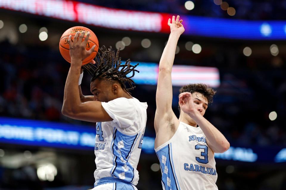 North Carolina forward Jae'Lyn Withers, left, grabs a rebound during the ACC Tournament championship game against North Carolina State.