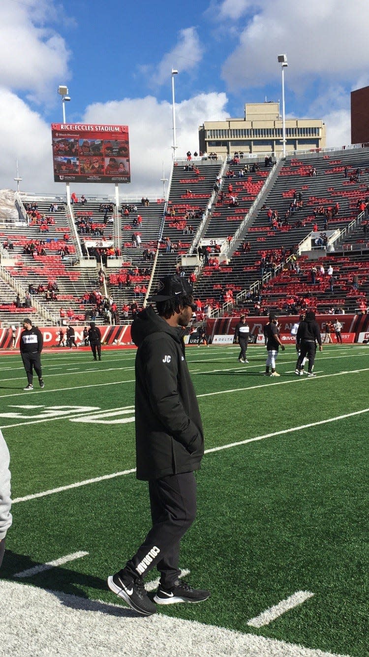 Colorado quarterback Shedeur Sanders walks on the sideline prior to the Buffaloes' game against Utah at Rice-Eccles Stadium in Salt Lake City on Nov. 25, 2023.