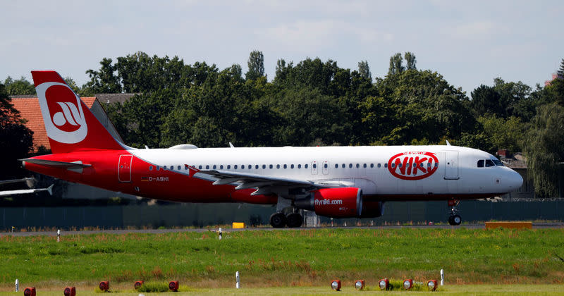 FILE PHOTO: An aircraft operated by German carrier Niki and Air Berlin sits on the tarmac of Berlin's Tegel airport, Germany, August 23, 2017. REUTERS/Fabrizio Bensch/File Photo