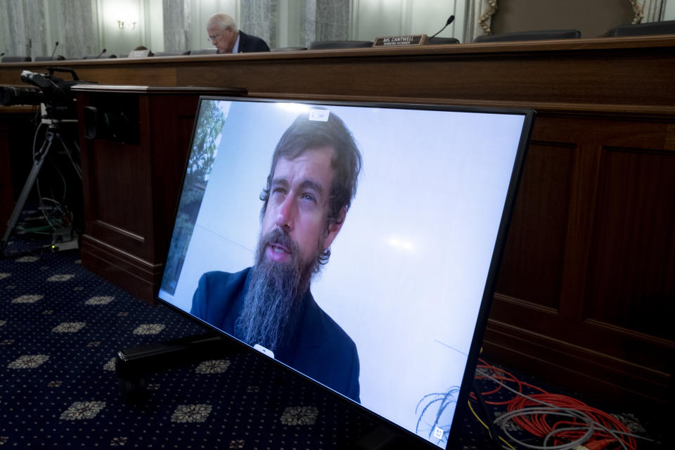 WASHINGTON, DC - OCTOBER 28: CEO of Twitter Jack Dorsey appears on a monitor as Chairman of the Senate Commerce, Science, and Transportation Committee Roger Wicker (Back) listens during the Senate Commerce, Science, and Transportation Committee hearing 'Does Section 230's Sweeping Immunity Enable Big Tech Bad Behavior?', on Capitol Hill, October 28, 2020 in Washington, DC. CEO of Twitter Jack Dorsey; CEO of Alphabet Inc. and its subsidiary Google LLC, Sundar Pichai; and CEO of Facebook Mark Zuckerberg all testified virtually at the hearing. Section 230 of the Communications Decency Act guarantees that tech companies can not be sued for content on their platforms, but the Justice Department has suggested limiting this legislation. (Photo by Michael Reynolds-Pool/Getty Images)