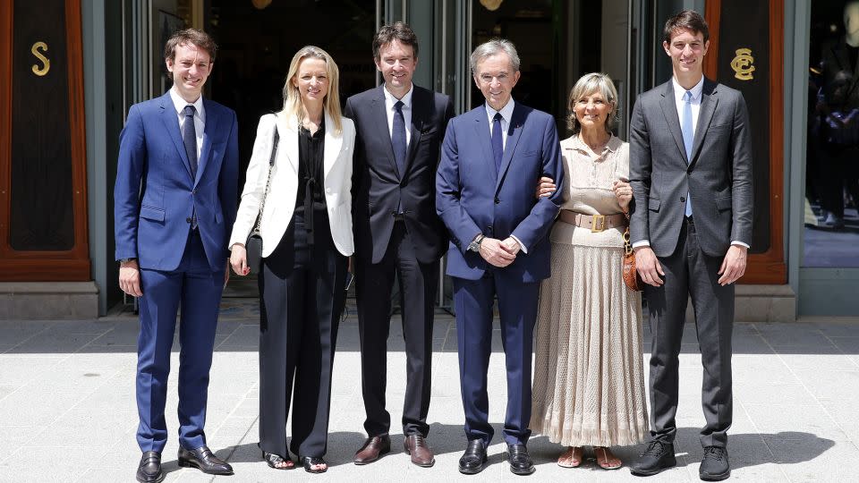 LVMH's Bernard Arnault pictured in Paris with his wife Helene and four of his five children, from left: Frederic, Delphine, Antoine and Alexandre. All five of his children work at the company. - Chesnot/Getty Images