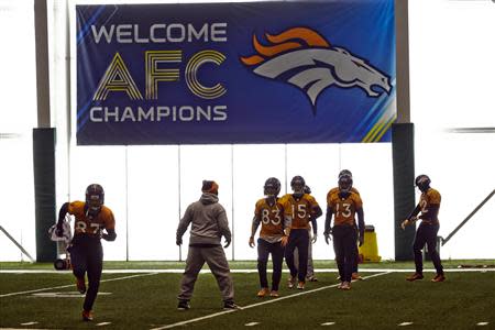 Denver Broncos wide receiver Eric Decker moves to catch a pass as they hold an indoor practice session for the Super Bowl at the New York Jets Training Center in Florham Park, New Jersey January 30, 2014. REUTERS/Ray Stubblebine